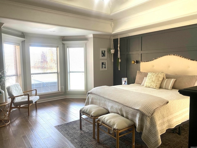 bedroom with dark hardwood / wood-style floors and crown molding