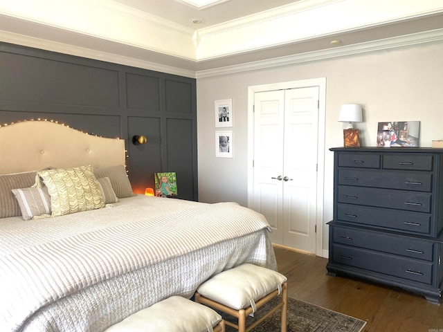 bedroom featuring dark hardwood / wood-style flooring and ornamental molding