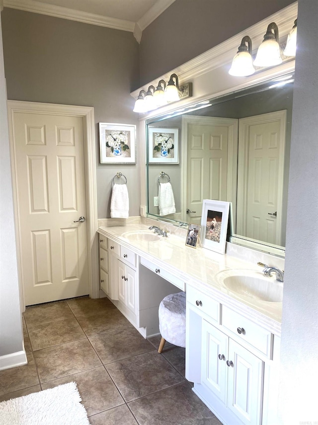 bathroom featuring tile patterned flooring, vanity, and crown molding