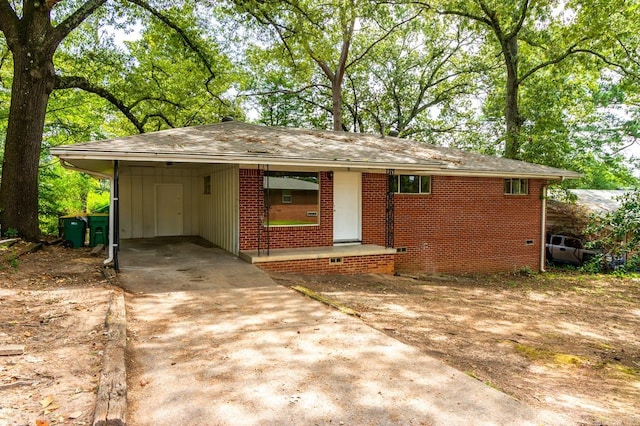 single story home with a carport