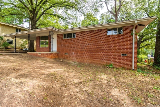 rear view of property featuring covered porch