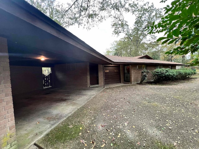 view of side of property featuring a carport