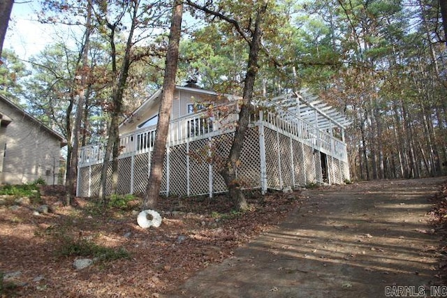 exterior space featuring a wooden deck