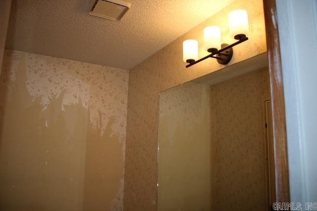 bathroom featuring a textured ceiling