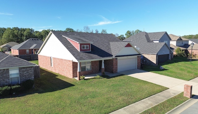 view of front of home with a front yard and a garage