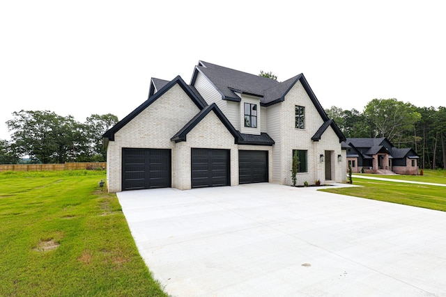 view of front facade with a front yard and a garage