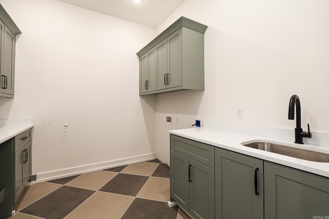 washroom with sink, cabinets, and washer hookup