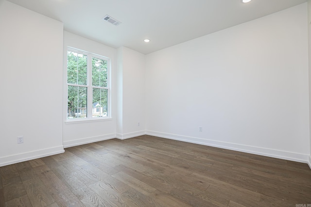 empty room featuring dark wood-type flooring