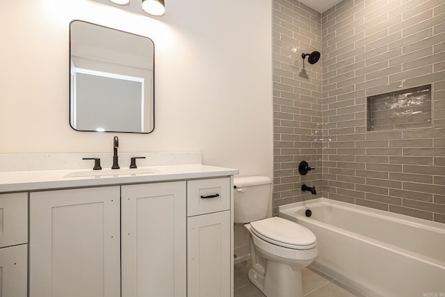 full bathroom with tile patterned flooring, vanity, toilet, and tiled shower / bath