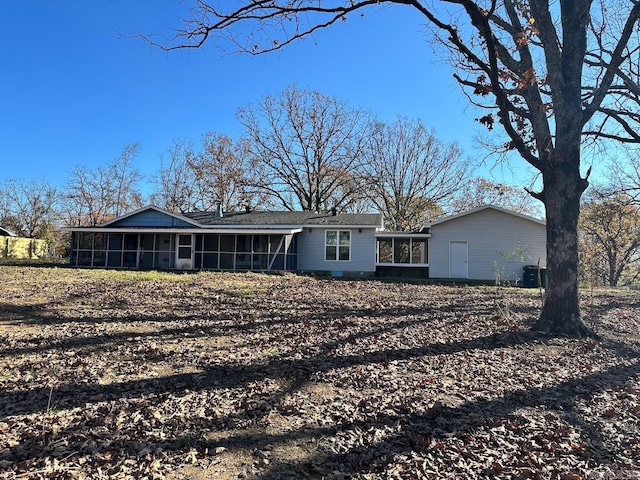 back of house featuring a sunroom