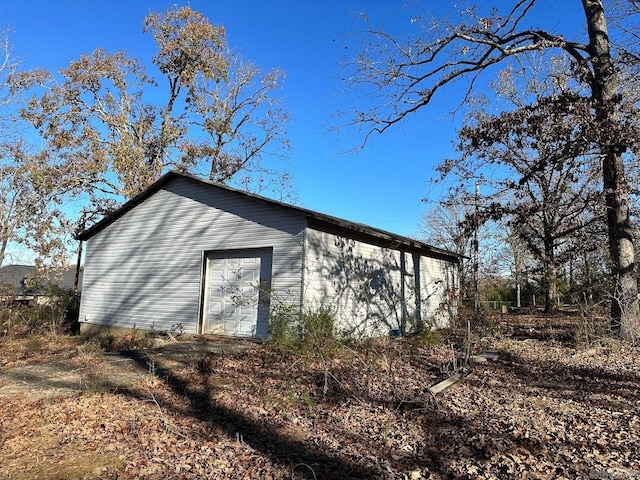 view of side of property with an outbuilding