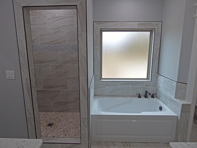 62 Highland Cove Dr, Highland, AR 72542 - full bathroom featuring a garden tub and tiled shower