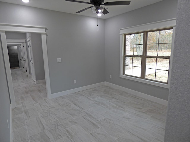 62 Highland Cove Dr, Highland, AR 72542 - spare room featuring ceiling fan and baseboards