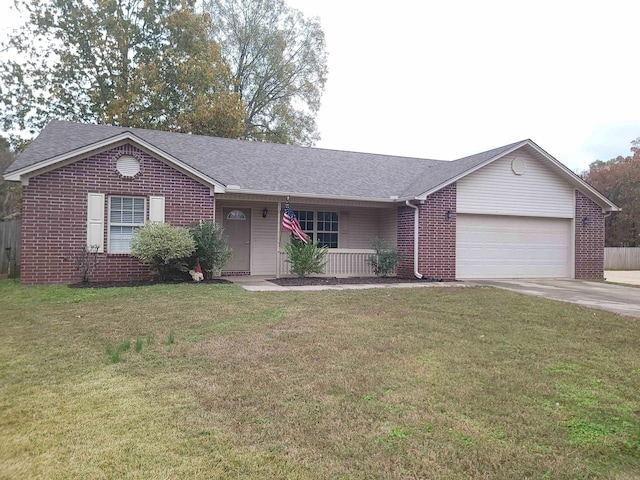 single story home with a front yard and a garage