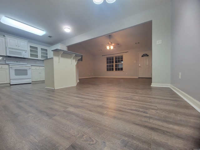 kitchen featuring wood-type flooring, white appliances, white cabinetry, and ceiling fan