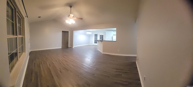 unfurnished living room with ceiling fan, dark hardwood / wood-style flooring, and lofted ceiling