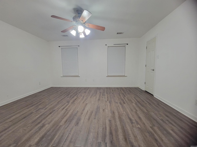 unfurnished room featuring dark hardwood / wood-style floors and ceiling fan