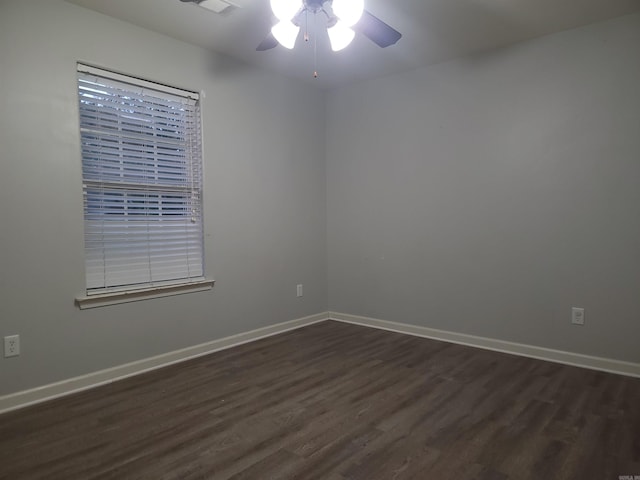 empty room featuring dark hardwood / wood-style floors and ceiling fan