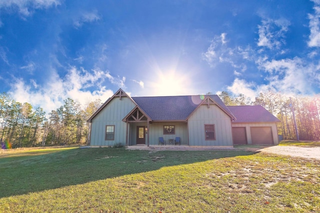 view of front of home featuring a garage and a front lawn