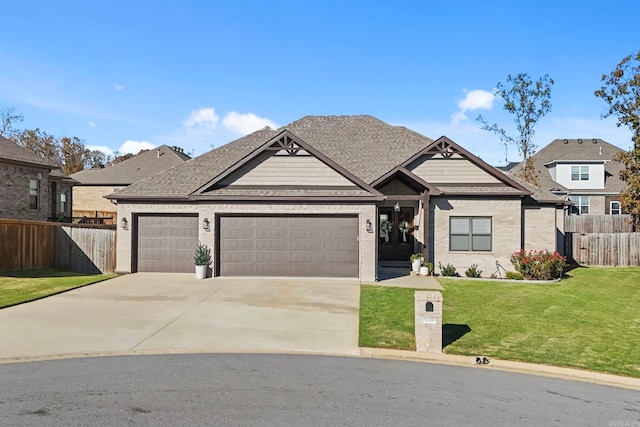 view of front of home with a garage and a front lawn