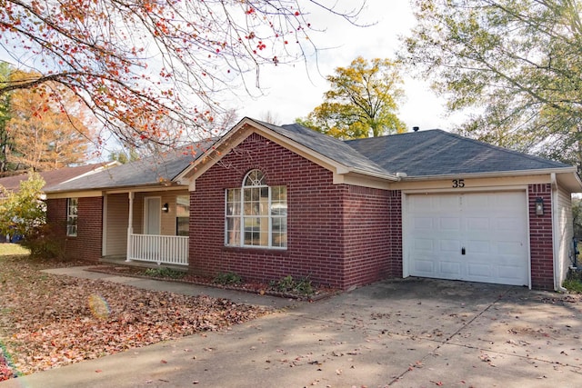 single story home featuring covered porch and a garage