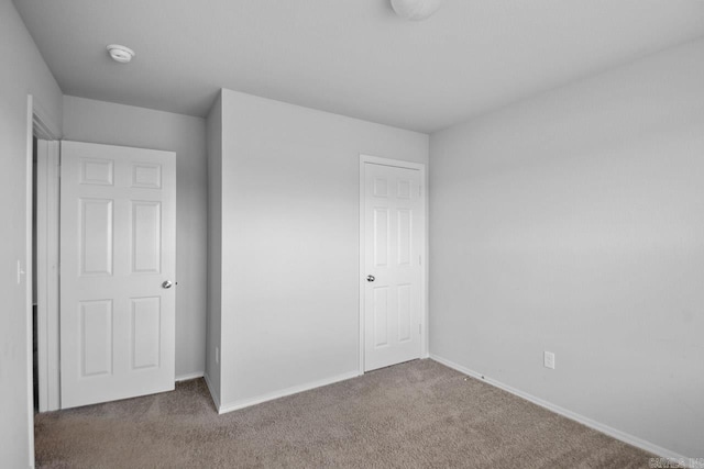 unfurnished bedroom featuring carpet