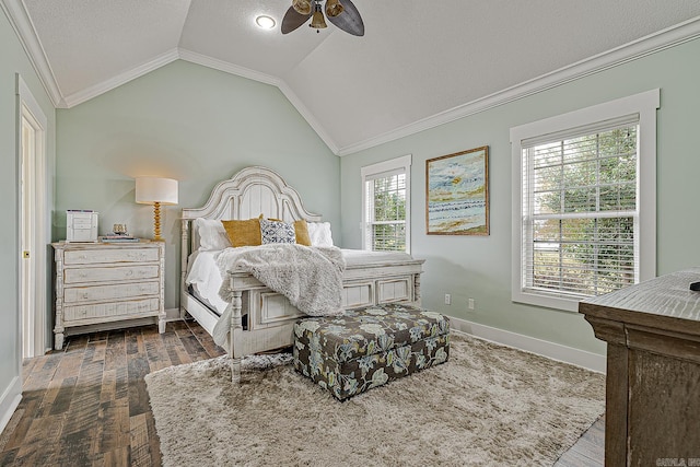 bedroom featuring dark hardwood / wood-style flooring, crown molding, ceiling fan, and lofted ceiling