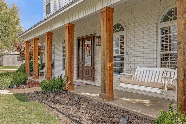 entrance to property featuring a porch