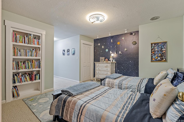 carpeted bedroom featuring a closet and a textured ceiling