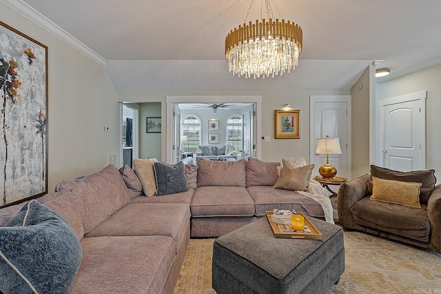 living room featuring a textured ceiling, ceiling fan with notable chandelier, light colored carpet, and ornamental molding