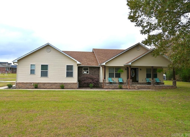 view of front of home with covered porch and a front yard