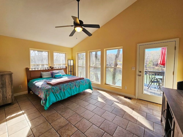 tiled bedroom with ceiling fan, access to exterior, and high vaulted ceiling