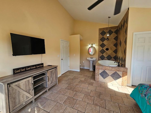 kitchen with butcher block counters, ceiling fan, high vaulted ceiling, and light tile patterned floors