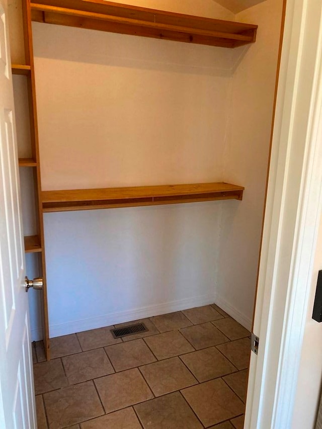 spacious closet with tile patterned flooring