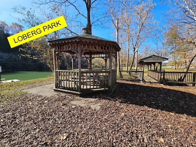 view of home's community featuring a gazebo and a water view