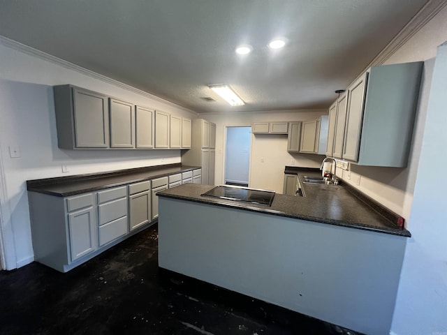 kitchen with kitchen peninsula, gray cabinets, ornamental molding, and sink