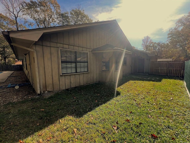 view of property exterior featuring a yard