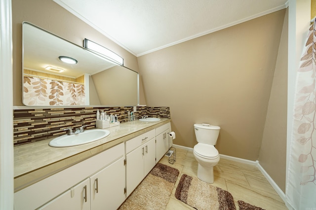 bathroom featuring tile patterned floors, crown molding, toilet, decorative backsplash, and vanity