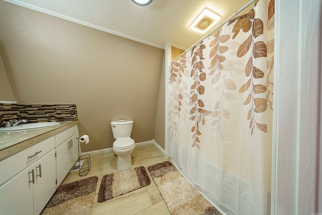 bathroom with tile patterned flooring, vanity, and toilet