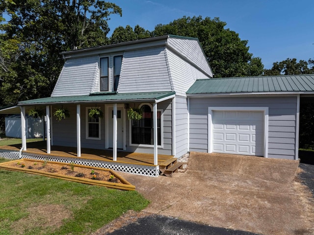 view of front of property featuring a porch and a garage