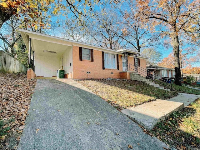 single story home featuring a carport