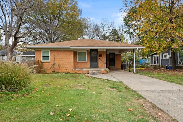 view of front facade featuring a front yard and a carport