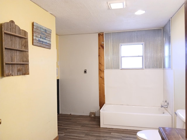 802 Casey St, Leslie, AR 72645 - full bathroom with toilet, wood finished floors, and shower / bathtub combination