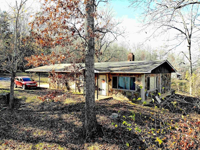 view of front of home featuring a carport