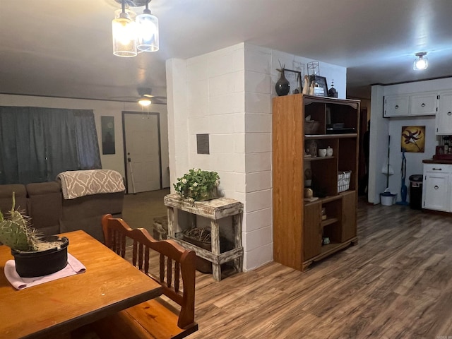 dining area featuring ceiling fan and wood-type flooring