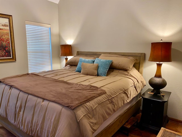 bedroom featuring dark hardwood / wood-style flooring