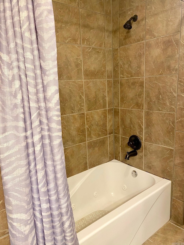 bathroom featuring tile patterned floors and shower / bath combination with curtain