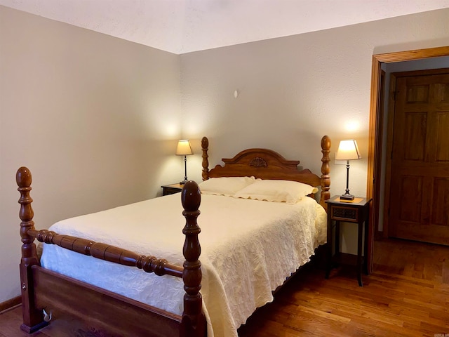 bedroom with wood-type flooring