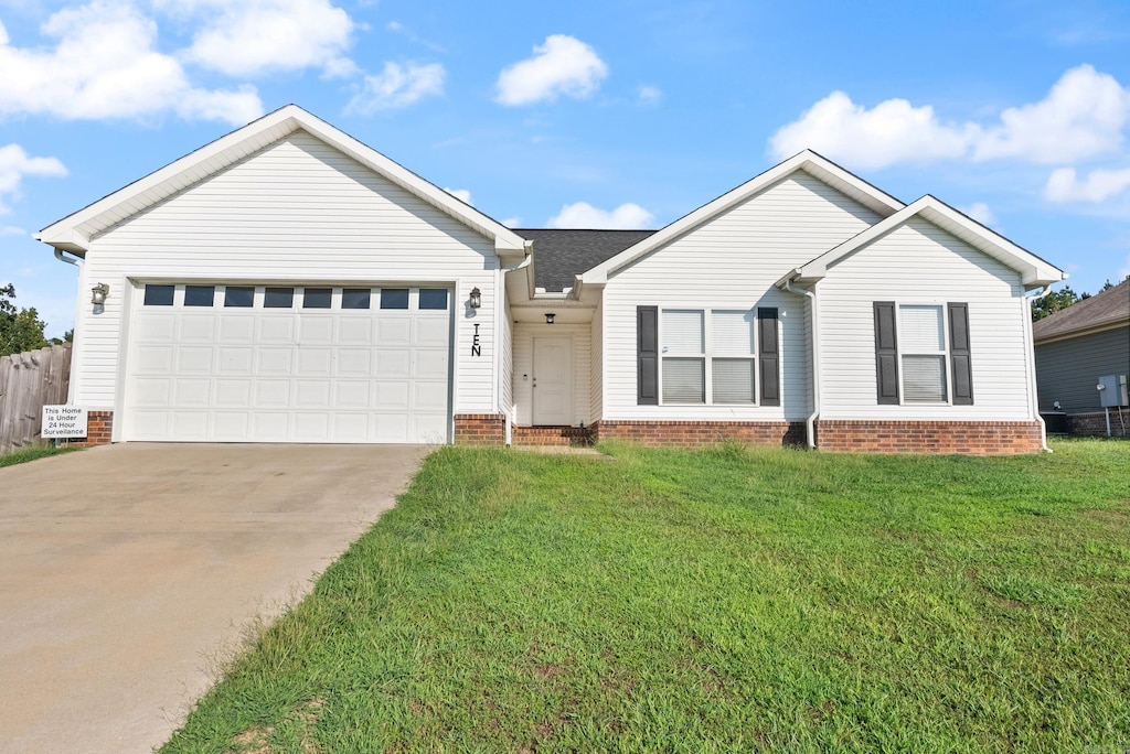 single story home with a front lawn and a garage