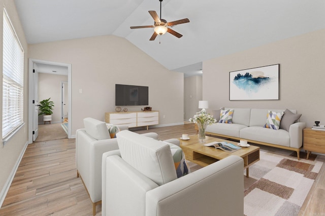 living room with light hardwood / wood-style flooring, ceiling fan, and lofted ceiling